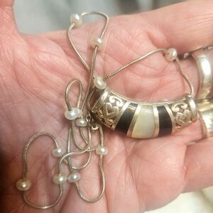 VINTAGE STERLING,ONYX &MOP SLIDE WITH STERLING &PEARL CHAIN